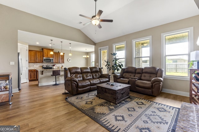 206 Barnyard Way, Perry, GA 31069 - living area with lofted ceiling, ceiling fan, and wood finished floors