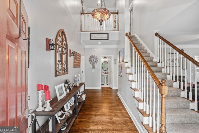 507 Wintergreen Way, Canton, GA 30115 - foyer entrance featuring a towering ceiling, stairway, ornamental molding, and wood finished floors