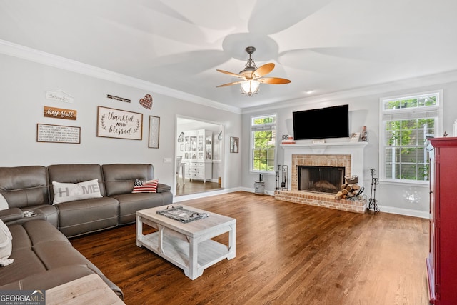 507 Wintergreen Way, Canton, GA 30115 - living area with ornamental molding, a ceiling fan, wood finished floors, and a brick fireplace