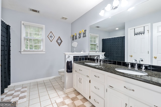 507 Wintergreen Way, Canton, GA 30115 - full bathroom with double vanity, a shower with shower curtain, and tile patterned flooring