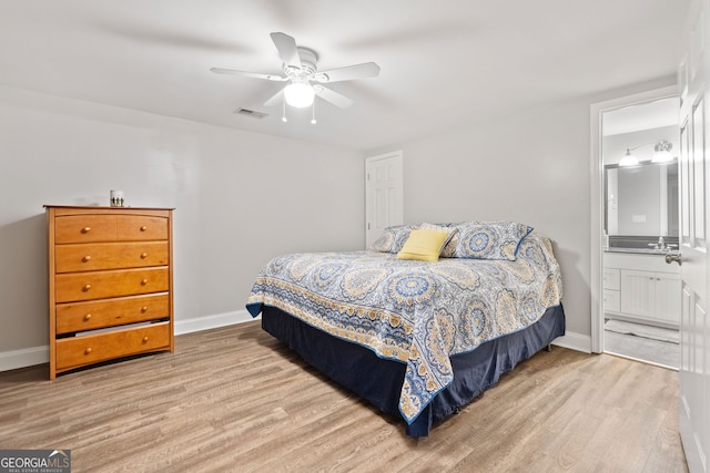 507 Wintergreen Way, Canton, GA 30115 - bedroom featuring wood finished floors, connected bathroom, and a ceiling fan