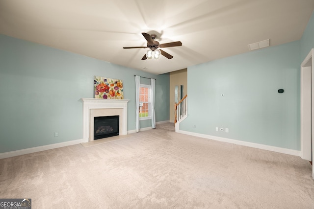 872 Misty View Ct, Lilburn, GA 30047 - unfurnished living room featuring light colored carpet, a glass covered fireplace, and ceiling fan