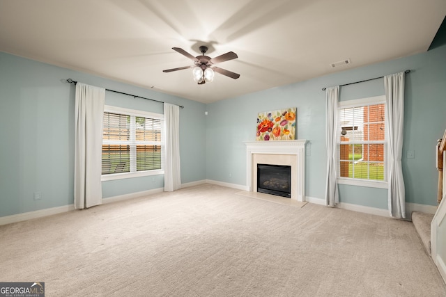 872 Misty View Ct, Lilburn, GA 30047 - unfurnished living room featuring a premium fireplace, ceiling fan, and carpet