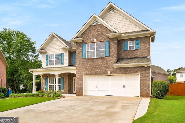 872 Misty View Ct, Lilburn, GA 30047 - view of front of home with brick siding, driveway, a garage, and covered porch