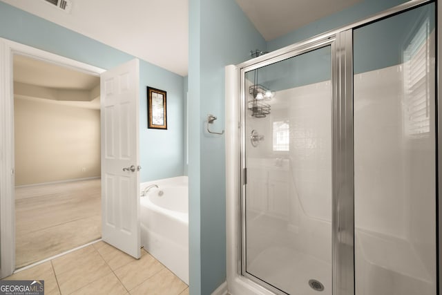 872 Misty View Ct, Lilburn, GA 30047 - bathroom featuring a garden tub, a stall shower, and tile patterned flooring