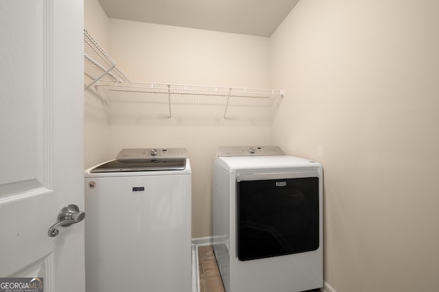 872 Misty View Ct, Lilburn, GA 30047 - laundry area with independent washer and dryer and baseboards