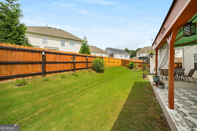 872 Misty View Ct, Lilburn, GA 30047 - fenced backyard featuring a patio and a residential view