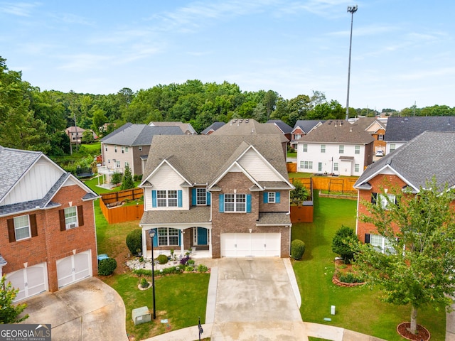 872 Misty View Ct, Lilburn, GA 30047 - traditional home with an attached garage, concrete driveway, and a residential view