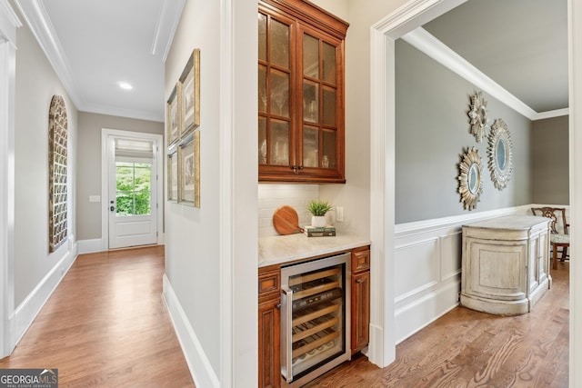 3047 Watsons Bnd, Milton, GA 30004 - indoor dry bar with wine cooler, crown molding, light wood finished floors, tasteful backsplash, and recessed lighting