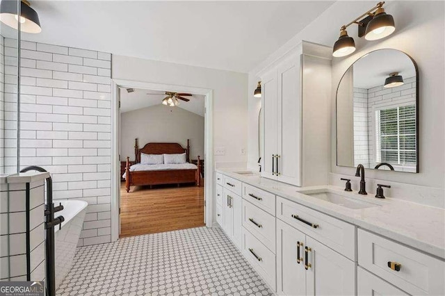 2508 Haddenham Ln SW, Smyrna, GA 30082 - ensuite bathroom featuring double vanity, a freestanding bath, and a ceiling fan