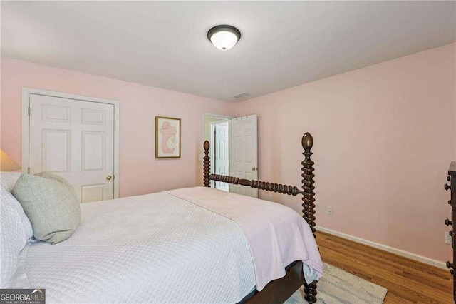 2508 Haddenham Ln SW, Smyrna, GA 30082 - bedroom featuring wood finished floors and baseboards