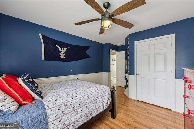 2508 Haddenham Ln SW, Smyrna, GA 30082 - bedroom with wainscoting, wood finished floors, and ceiling fan