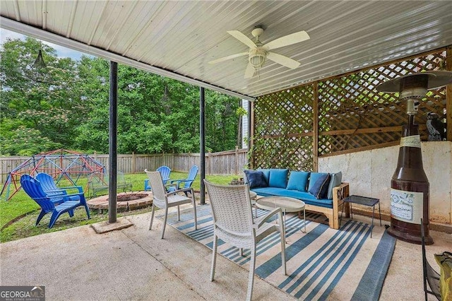 2508 Haddenham Ln SW, Smyrna, GA 30082 - fenced backyard with a patio, ceiling fan, and an outdoor living space with a fire pit