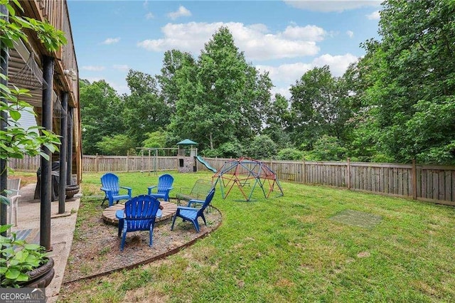 2508 Haddenham Ln SW, Smyrna, GA 30082 - fenced backyard featuring a playground and a fire pit