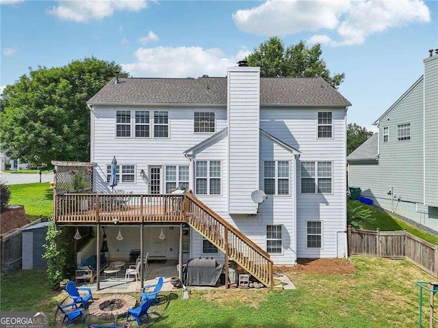 2508 Haddenham Ln SW, Smyrna, GA 30082 - rear view of property with an outdoor fire pit, a wooden deck, a patio area, stairway, and a chimney