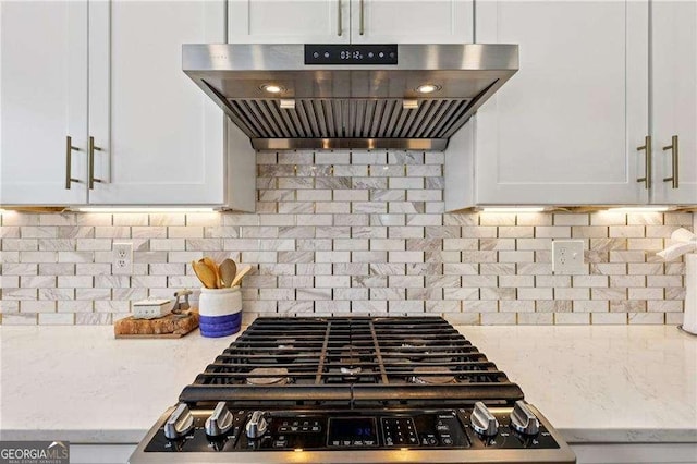 2508 Haddenham Ln SW, Smyrna, GA 30082 - kitchen featuring range hood, stainless steel gas range, white cabinets, and light stone counters