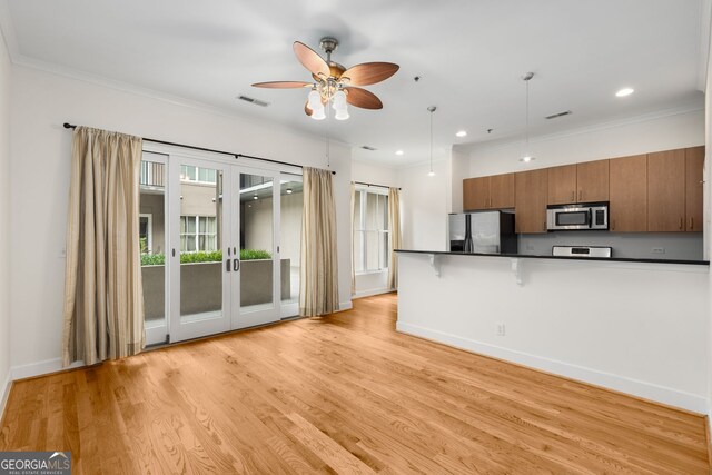 384 Ralph Mcgill Blvd NE Unit 123, Atlanta, GA 30312 - kitchen with appliances with stainless steel finishes, french doors, dark countertops, brown cabinets, and a ceiling fan