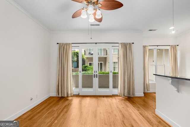 384 Ralph Mcgill Blvd NE Unit 123, Atlanta, GA 30312 - unfurnished room featuring french doors, ornamental molding, ceiling fan, and light wood-style flooring