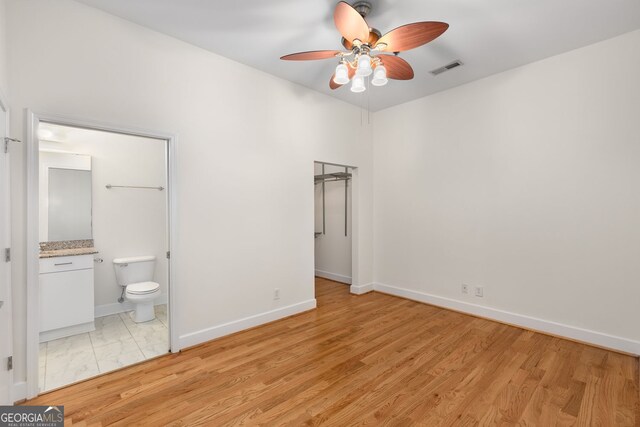 384 Ralph Mcgill Blvd NE Unit 123, Atlanta, GA 30312 - unfurnished bedroom with connected bathroom and ceiling fan
