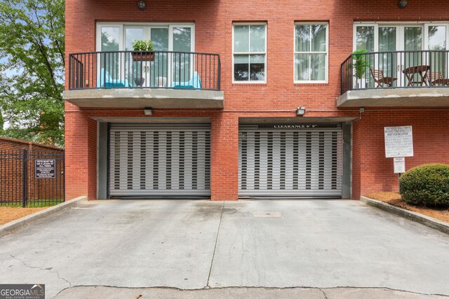 384 Ralph Mcgill Blvd NE Unit 123, Atlanta, GA 30312 - view of property featuring driveway and an attached garage