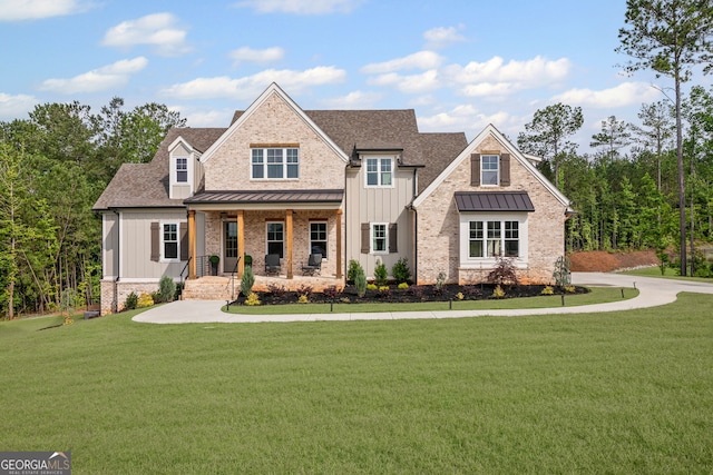 40 Fernbank Way, Newnan, GA 30265 - craftsman-style house featuring a standing seam roof, a porch, board and batten siding, and a front lawn
