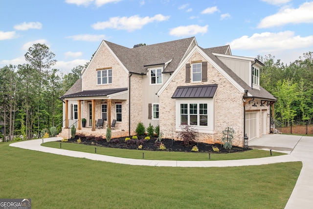 40 Fernbank Way, Newnan, GA 30265 - view of front of house with driveway, an attached garage, a porch, a standing seam roof, and a shingled roof