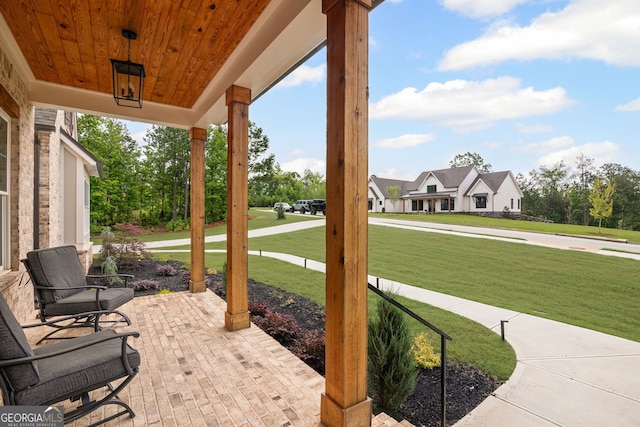 40 Fernbank Way, Newnan, GA 30265 - covered porch featuring a yard