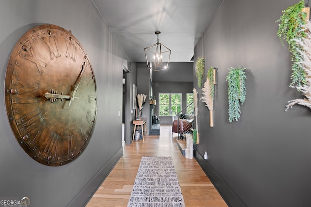 40 Fernbank Way, Newnan, GA 30265 - hallway with wood finished floors and a chandelier