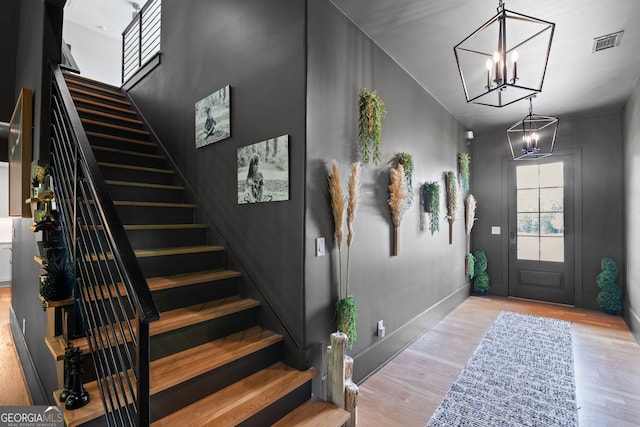 40 Fernbank Way, Newnan, GA 30265 - entryway with a chandelier, stairs, and wood finished floors