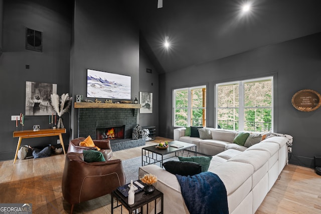 40 Fernbank Way, Newnan, GA 30265 - living area featuring high vaulted ceiling, wood finished floors, and a brick fireplace