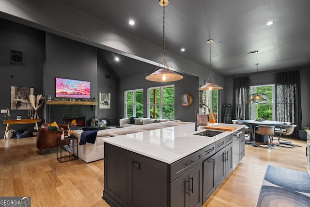40 Fernbank Way, Newnan, GA 30265 - kitchen featuring light wood-style flooring, healthy amount of natural light, pendant lighting, recessed lighting, and a kitchen island with sink