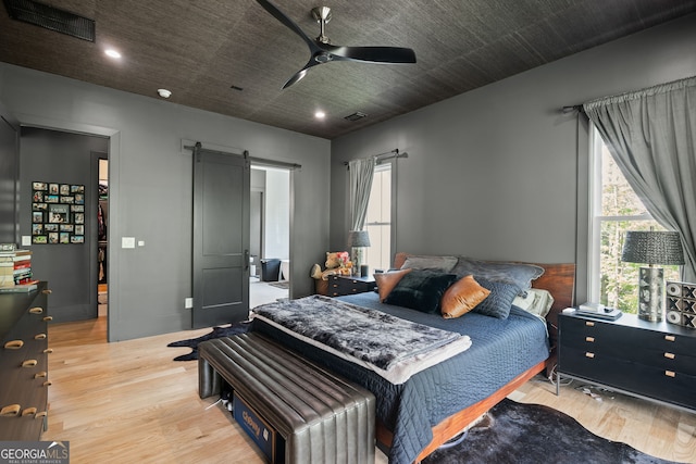 40 Fernbank Way, Newnan, GA 30265 - bedroom featuring wood finished floors, a barn door, recessed lighting, and ceiling fan