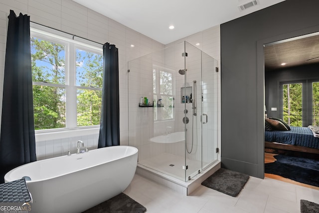40 Fernbank Way, Newnan, GA 30265 - full bath featuring plenty of natural light, a freestanding tub, a shower stall, ensuite bathroom, and recessed lighting