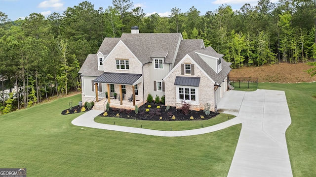 40 Fernbank Way, Newnan, GA 30265 - view of front of home featuring a porch, a standing seam roof, concrete driveway, and a front yard