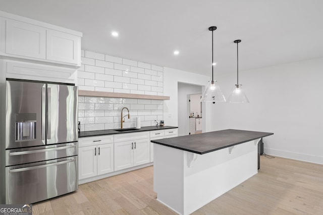 40 Fernbank Way, Newnan, GA 30265 - kitchen with stainless steel refrigerator with ice dispenser, dark countertops, open shelves, backsplash, and recessed lighting