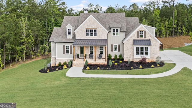 40 Fernbank Way, Newnan, GA 30265 - view of front of home with covered porch, a standing seam roof, and a front lawn