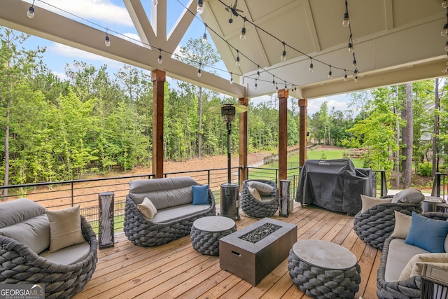 40 Fernbank Way, Newnan, GA 30265 - wooden deck featuring an outdoor living space with a fire pit and grilling area