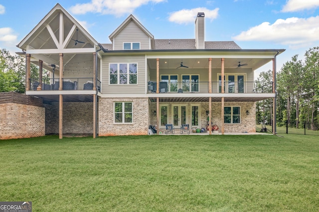 40 Fernbank Way, Newnan, GA 30265 - back of property featuring a balcony, ceiling fan, a patio area, and a chimney