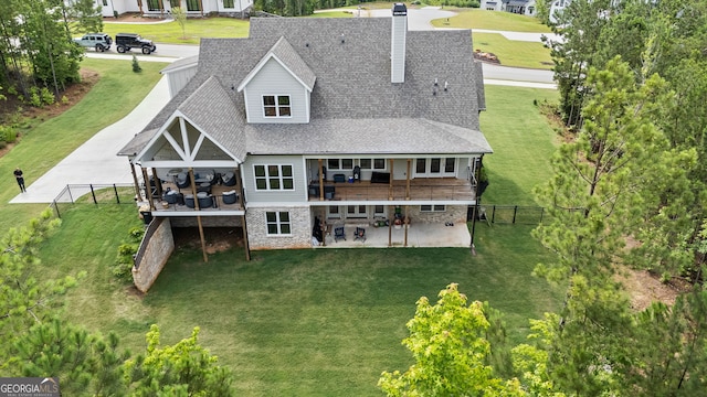 40 Fernbank Way, Newnan, GA 30265 - rear view of house with roof with shingles, a chimney, and a patio