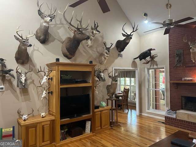 370 Butler Path, Dallas, GA 30132 - living area featuring a ceiling fan, a fireplace, wood finished floors, and high vaulted ceiling