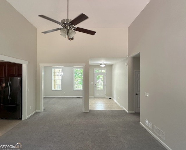 48 Narrow Ln, Dahlonega, GA 30533 - unfurnished living room with carpet flooring, a towering ceiling, and ceiling fan