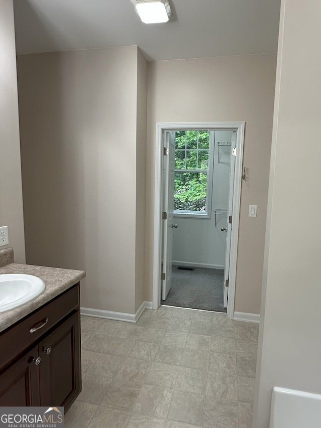 48 Narrow Ln, Dahlonega, GA 30533 - bathroom with vanity and baseboards
