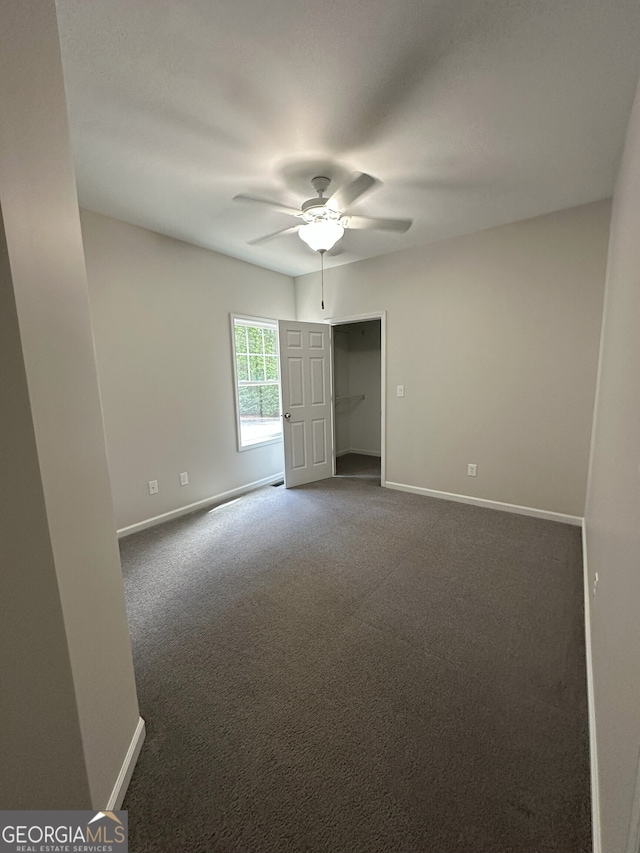 48 Narrow Ln, Dahlonega, GA 30533 - unfurnished room featuring a ceiling fan and dark colored carpet