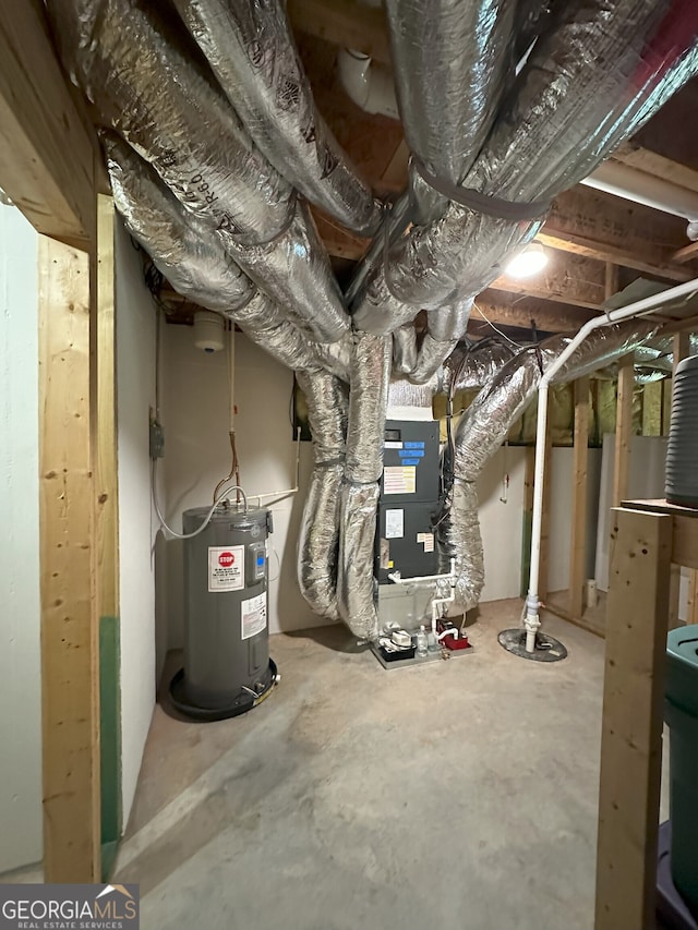 48 Narrow Ln, Dahlonega, GA 30533 - unfinished basement featuring water heater, heating unit, and drainage system