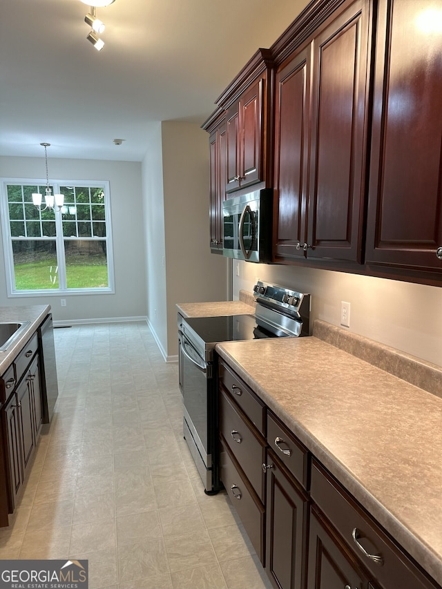 48 Narrow Ln, Dahlonega, GA 30533 - kitchen with stainless steel appliances, light countertops, a chandelier, dark brown cabinets, and light flooring