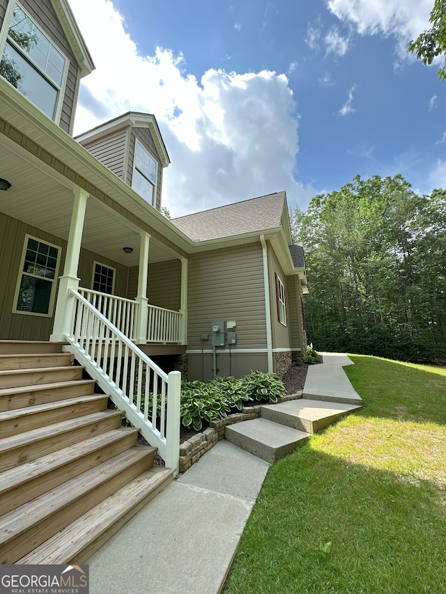 48 Narrow Ln, Dahlonega, GA 30533 - view of home's exterior featuring a porch, roof with shingles, a yard, and stairway