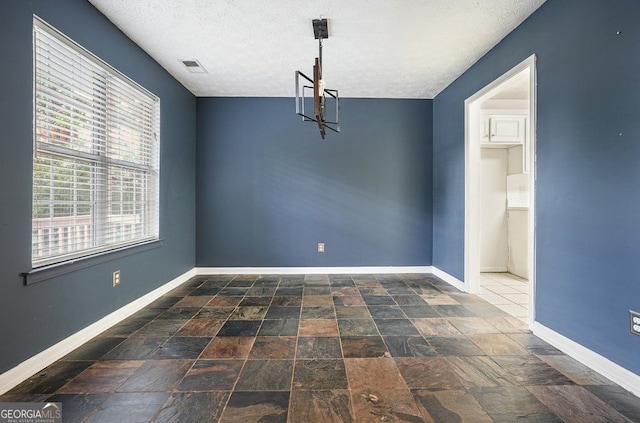 3366 English Oaks Dr NW, Kennesaw, GA 30144 - unfurnished dining area featuring a textured ceiling and a chandelier