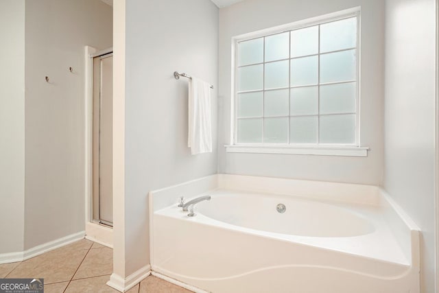 3366 English Oaks Dr NW, Kennesaw, GA 30144 - bathroom featuring a bath, a stall shower, and tile patterned floors