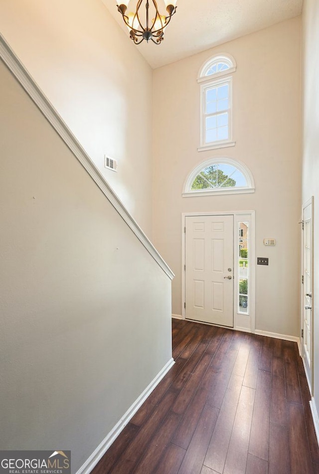 3366 English Oaks Dr NW, Kennesaw, GA 30144 - entryway with a chandelier, dark wood finished floors, and a high ceiling