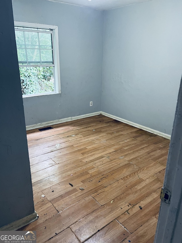 294 Pursley St, Macon, GA 31201 - spare room featuring hardwood / wood-style flooring